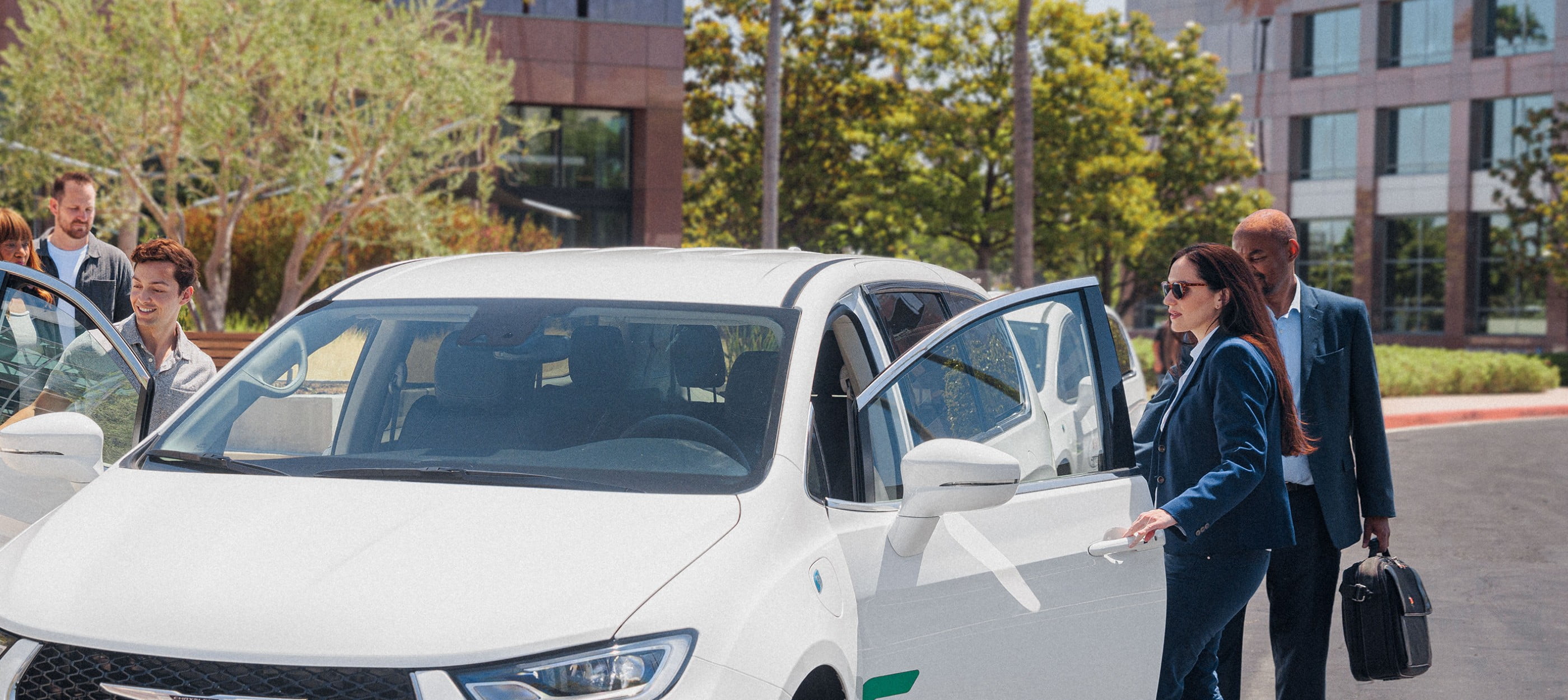 A group of business associates get into a white van