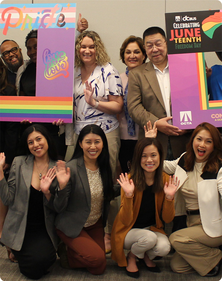 A group of OCTA team members smiling at the camera