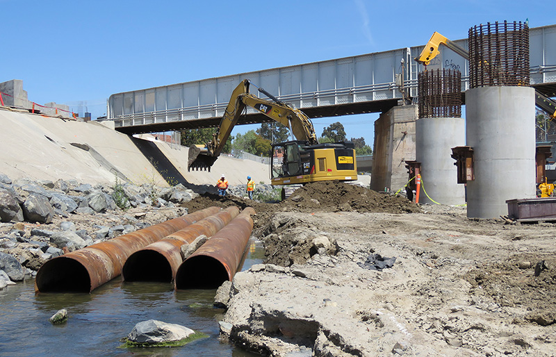 Crews constructing a diversion channel in San Juan Creek