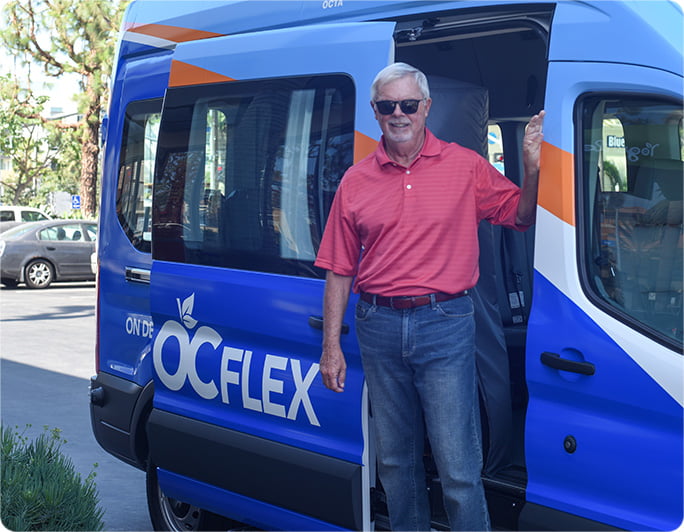 OC Flex van with a man standing inside the vehicle's open sliding door