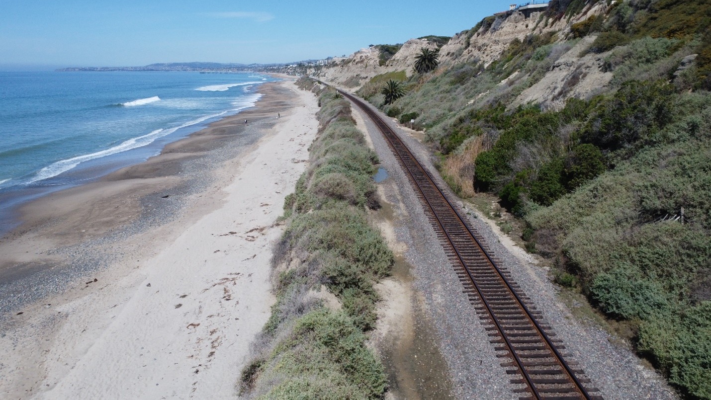 Shoreline protection structure area along existing eroded berm