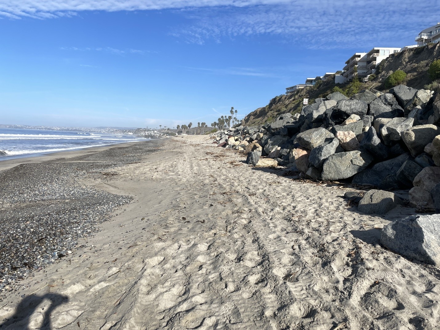 Typical current site conditions at low tide from beach facing northwest, high beach berm in background