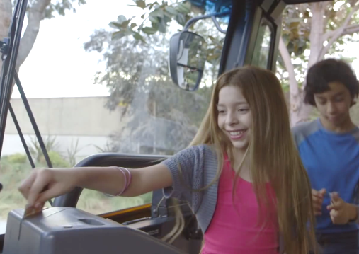 A girl paying bus fare